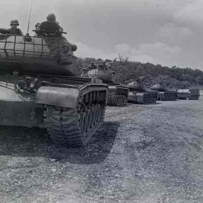 Line of tanks underway at a training ground