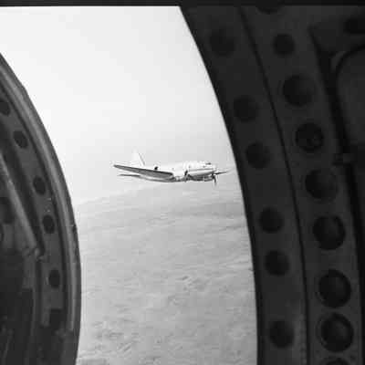 View of a C-46 aircraft in flight from another aircraft