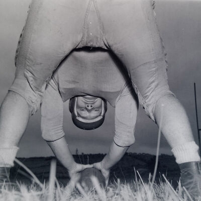 Looking between the legs of a football center