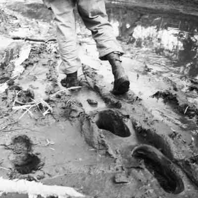 Soldier walking through deep mud