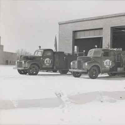 Fire trucks parked outside of the fire station