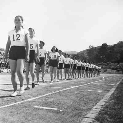 Japanese female athletes walk down track