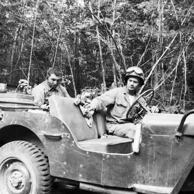 Soldier wiping down seat in Jeep