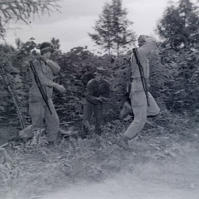 Soldier marching a "captured" soldier during war games
