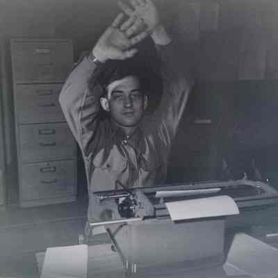 Soldier at his desk with typewriter
