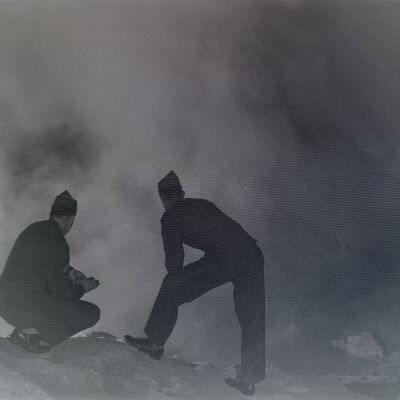 Two soldiers observing a steaming spring