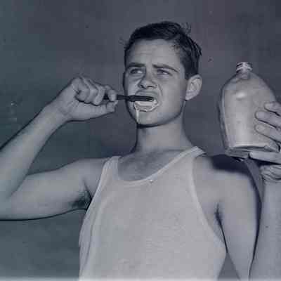 Soldier brushing his teeth