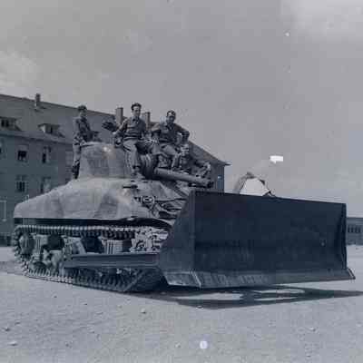 Soldiers standing on an M-4 Tank Dozer