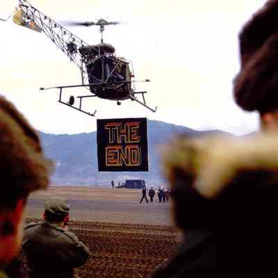 Helicopter holding sign signaling the end of the 45th Division's service in Korea