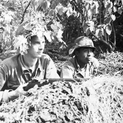 Soldiers with camouflage helmets