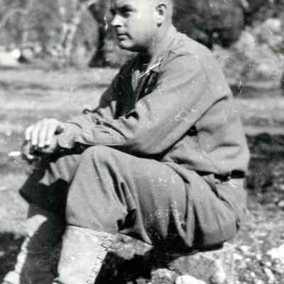 Soldier sitting on a rock