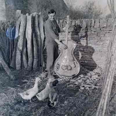 Soldier playing homemade bass for ducks