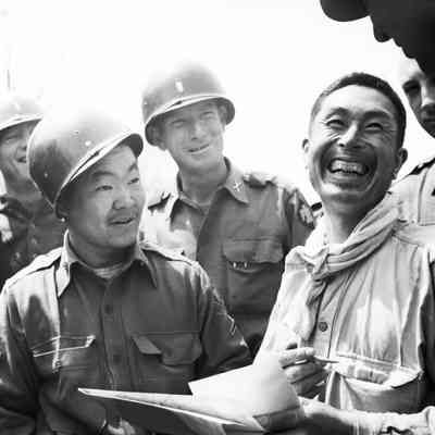 Soldiers with a Japanese civilian