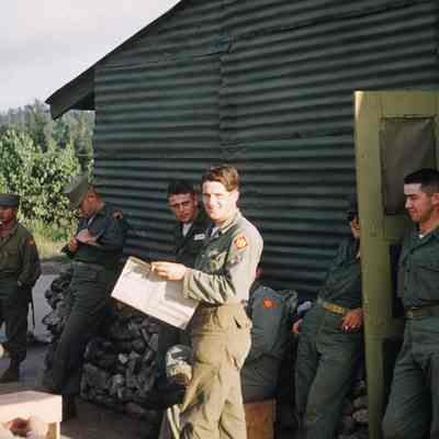 Soldiers relaxing outside a building