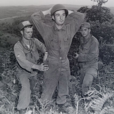 Soldiers searching "prisoner" during war game