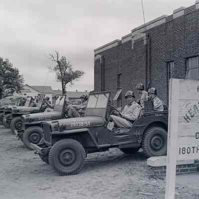 Soldiers sitting in jeeps