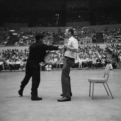 Photograph of Bruce Lee in martial arts demonstration
