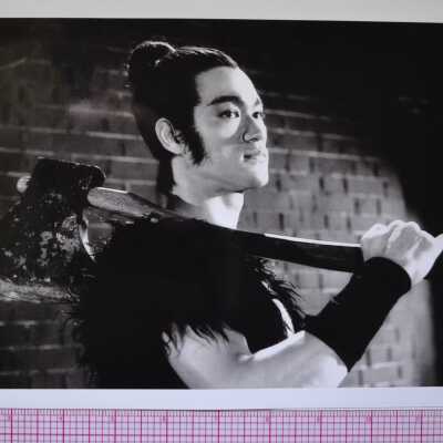 Photograph of Bruce Lee in stage makeup