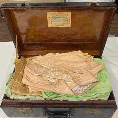 Black Wooden Suitcase with Clothes Inside