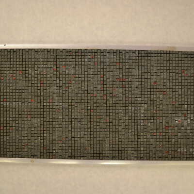 A Box with Metal Type Pieces