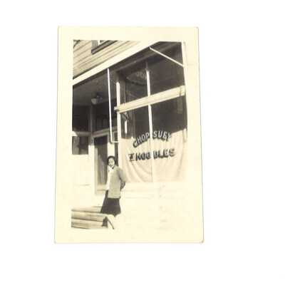 Girl in Front of "Chop Suey Noodles" Restaurant