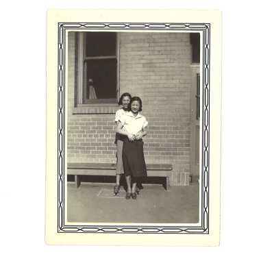 Two Women in Front of Brick Building