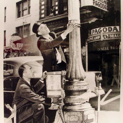 Photograph, Chinatown, hanging signs on lamp post, SF