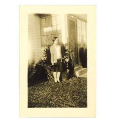 Girl Posing in Front of her House