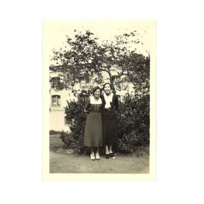 Lily Leong with a Friend Posing in Front of a Tree & Building