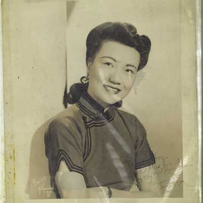 A Woman is Posing for a Photo with a Smile