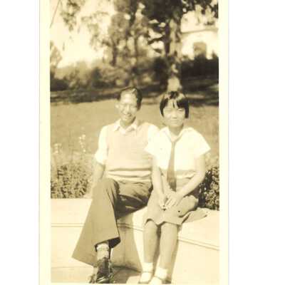Chinese Male and Chinese Girl Sitting at the Park