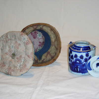 Woven basket with teapot