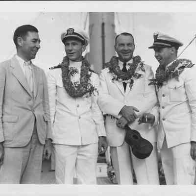 Left-Right: C.L. Bissell, U.S.A.; Lieut. Emory Stephens, U.S.N.; William T. Miller, superintendent of airways, U.S. Dept. of Commerce's bureau of aeronautics; and Frank Kenner, executive officer U.S.C.g. cutter Itasca. Photographed at Honolulu.