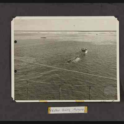 Water drums being hauled to Howland Island