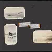 Supplies coming ashore Howland Island and man posing with cannon