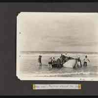 Image of men bringing supplies ashore