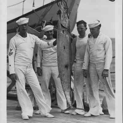 Crew aboard the Itasca with their catch - a 98 lb. Ono