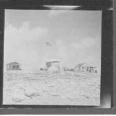 Richard E. Black, field representative of the U.S. Dept of the interior at Honolulu, holds a placque which will be placed on the lighthouse at Jarvis island in memory of Carl K. Kahalewai. The picture in the background is of James Kamakaiwai.