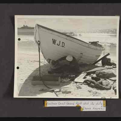 Repairs being made to a damaged surf boat W.J.D. damaged in surf on Howland Island, Jan. 26, 1937