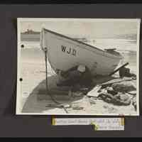 Repairs being made to a damaged surf boat W.J.D. damaged in surf on Howland Island, Jan. 26, 1937