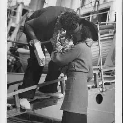 Solomon Kalama kisses his sister Margaret as he leaves on the USCG cutter Itasca on expedition to Baker, Howland and Jarvis.