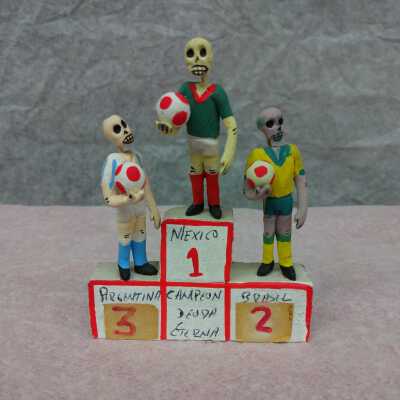 Miniature soccer players on a stand