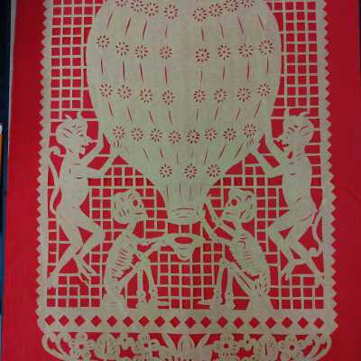 2 skeletons and 2 devils next to a hot air balloon- Papel Picado