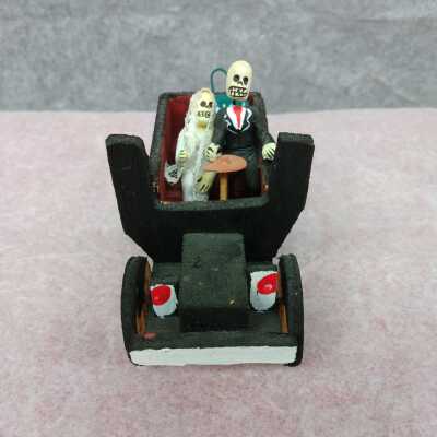 Miniature Married Skeletons in an Automobile