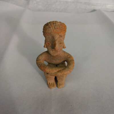 Terracotta sitting figurine