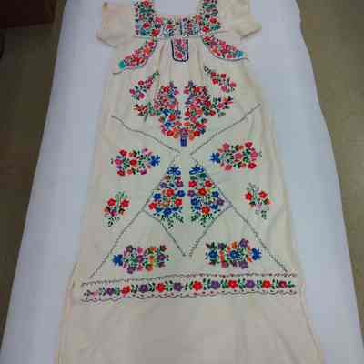 Cream colored dress with embroidered flowers