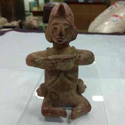 Figurine of a Seated Man Holding a Bowl