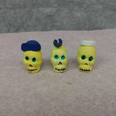 Three miniature skulls
