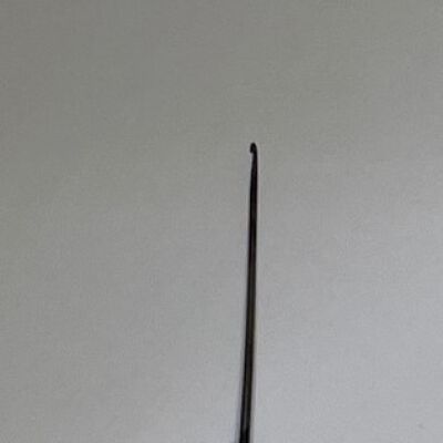 #3: Metal crochet hook embedded in a bone handle