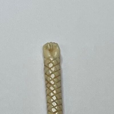 #2: A carved bone stiletto with an pointed awl at one end, a cross-hatched shaft and a finely carved fist at the top

The carved fist is unique
